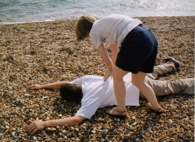 abbie checks nick for vital signs